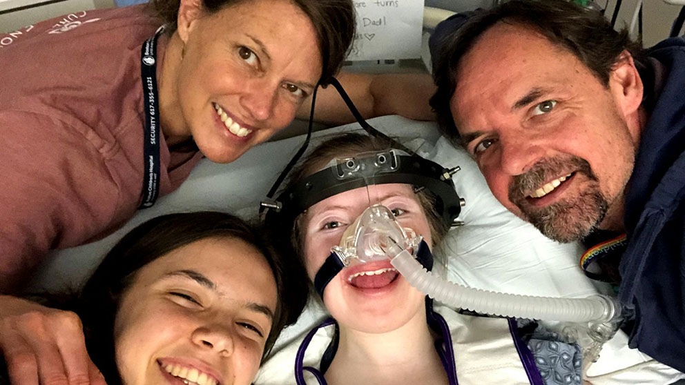 Talia Duff (center) with her family. Talia has Charcot Marie Tooth Type 4J and her family founded Cure CMT4J. Photo provided by Cure CMT4J.