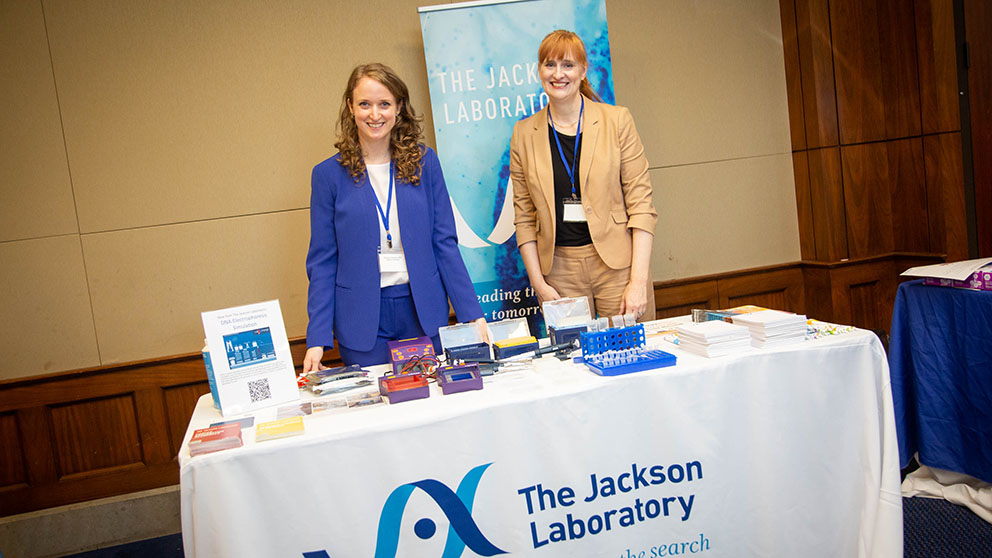 Christina Vallianatos (left) and Jill Homer Stewart (right) represent JAX and Genomic Education’s high school genetics program Teaching the Genome Generation™