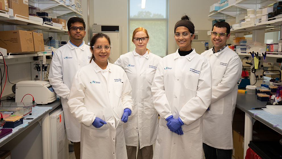 JAX's Christine Beck (center) with her lab group (l to r): Parithi Balachandran, Denisse Tafur, Isha Walawalkar, and Alex Nesta. Photo credit: Charles Camarda