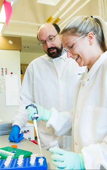 Associate Professor Greg Cox, Ph.D., and Cortney Latorgna prepare tissue samples for imaging, in order to analyze the degree of neurodegeneration in certain mouse models.  