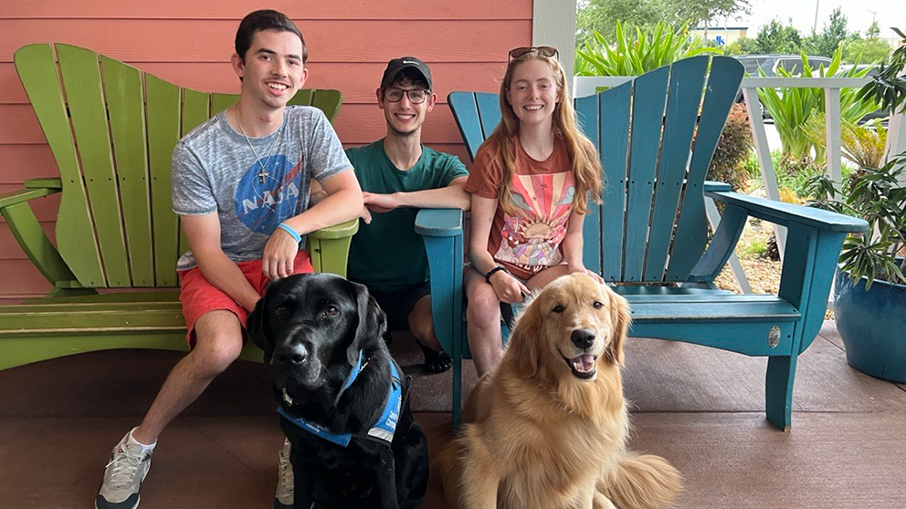 ­FA community members (l to r ) Noah, Christian, and Shandra with their service dogs (l to r) Schooner and Abbey. (Photo credit: FARA)