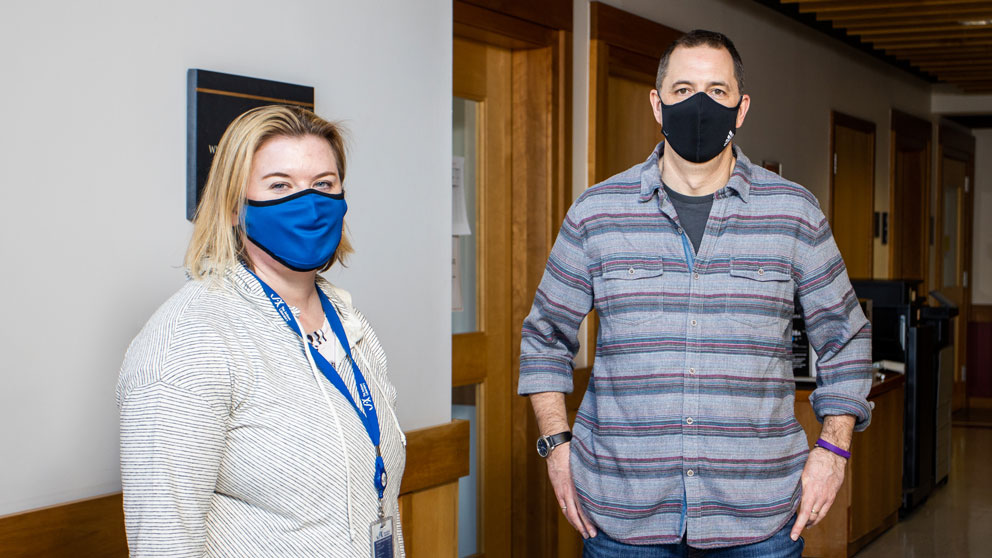 Gareth Howell and Kristen Onos in 2021 wearing casual PPE in their lab