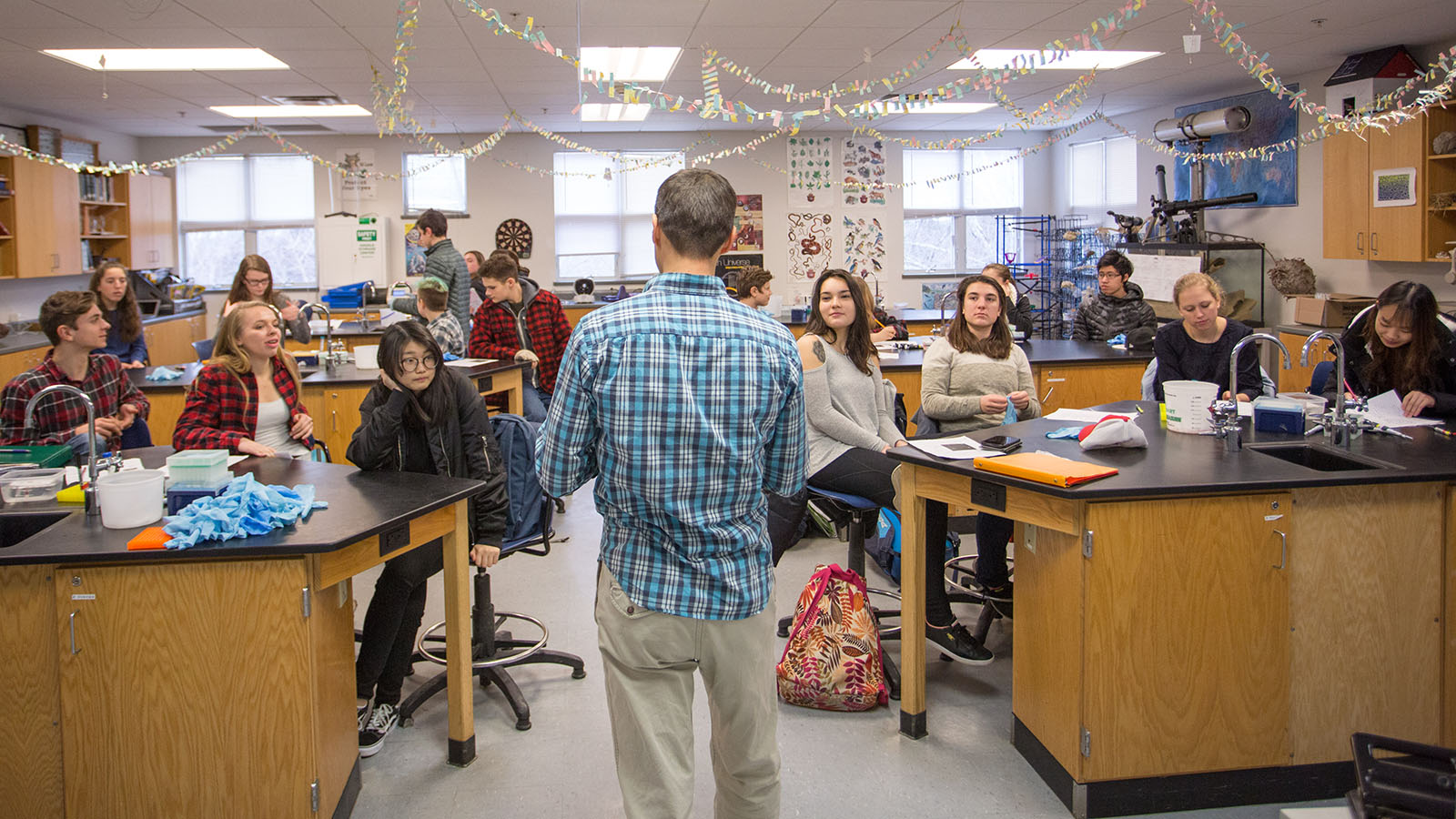 A photo of students learning JAX's 'Teaching the Genome Generation' curriculum at Lincoln Academy in Maine.