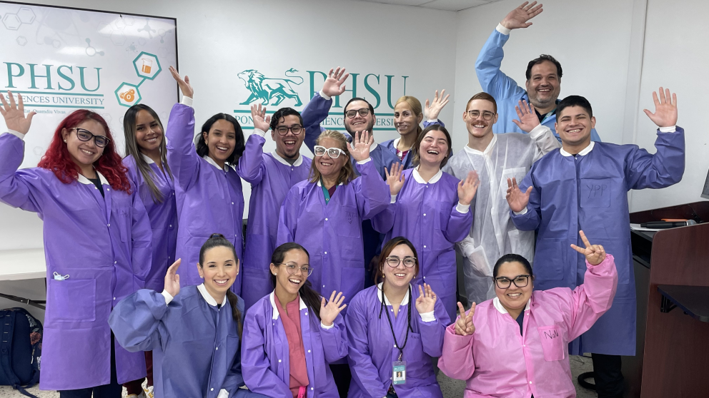 Students at Ponce Health Sciences University in Puerto Rico posing for a group photo during a workshop led by JAX Genomic Education.